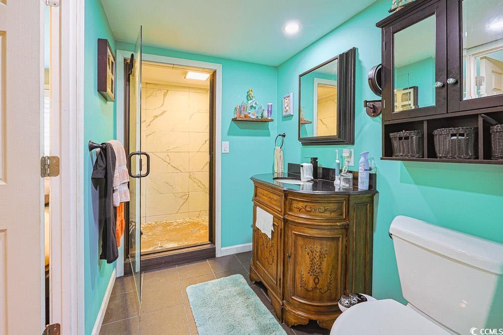 1911 Abba Court Conway, SC 29526 - Photo 14 of 25 Bedroom featuring wood finished floors, a ceiling fan, and two closets