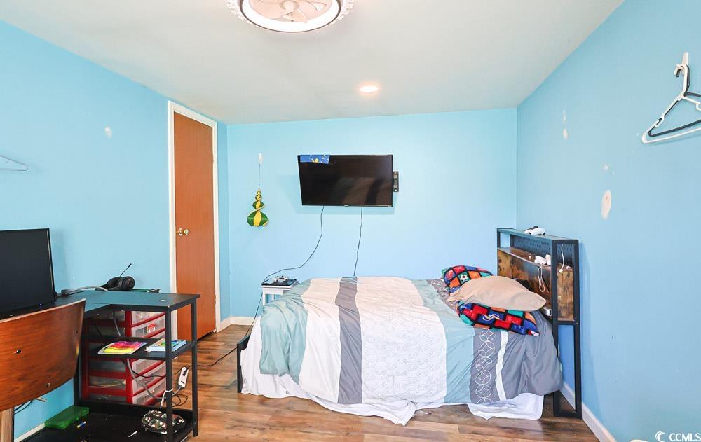 1911 Abba Court Conway, SC 29526 - Photo 20 of 25 Full bathroom with vanity, shower / bath combo, ornamental molding, and wood walls