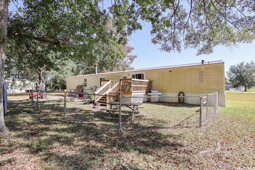 1911 Abba Court Conway, SC 29526 - Photo 22 of 25 Bedroom with dark wood-style floors and baseboards