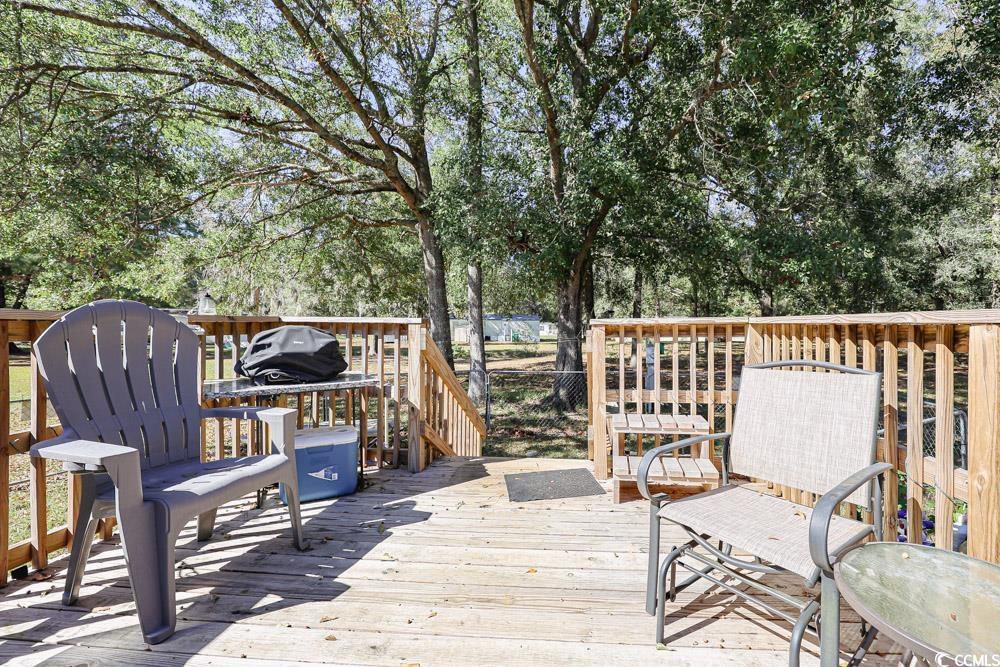 1911 Abba Court Conway, SC 29526 - Photo 24 of 25 Back of house featuring a wooden deck, a metal roof, stairs, and a gate