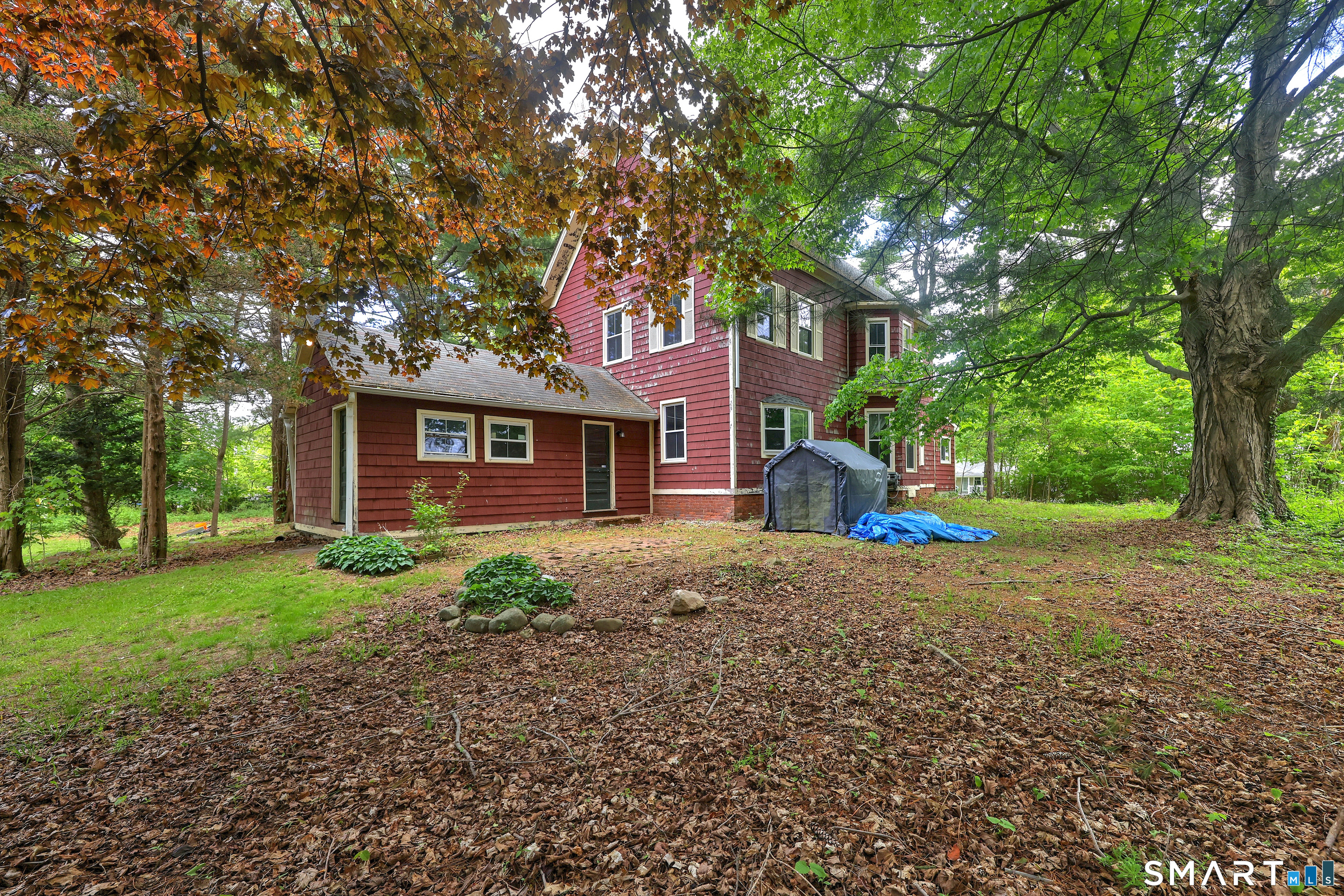 186 Jones Hill Road West Haven, CT 06516 - Photo 32 of 33 a front view of a house with a yard and trees