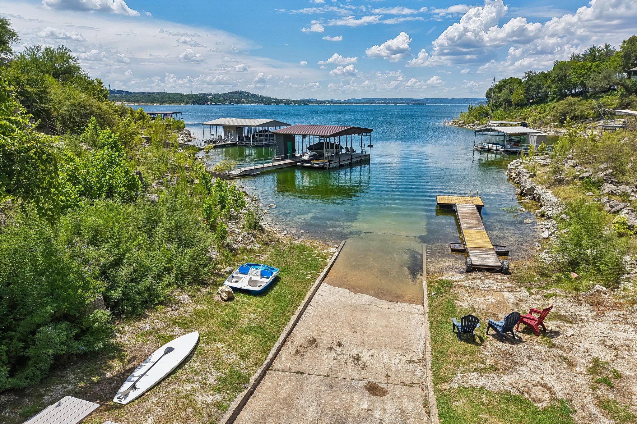 13101 Travis View Loop Austin, TX 78732 - Photo 23 of 27 The community boat launch dock extends into a quiet Lake Travis cove.
