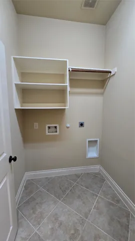 a view of a porch with furniture and floor to ceiling window