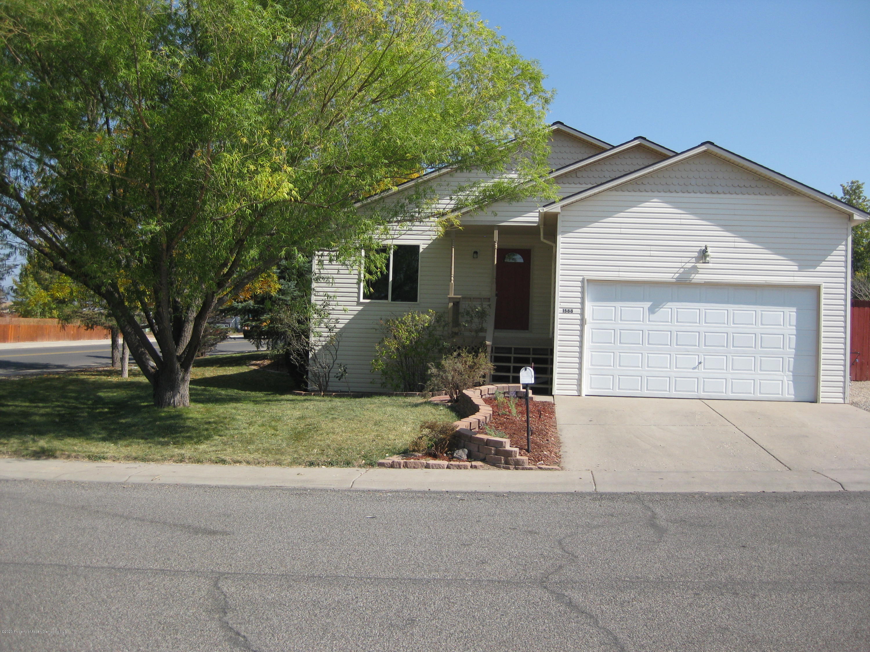 1588 Anvil View Avenue Rifle, CO 81650 - Photo 1 of 15 a front view of a house with garden