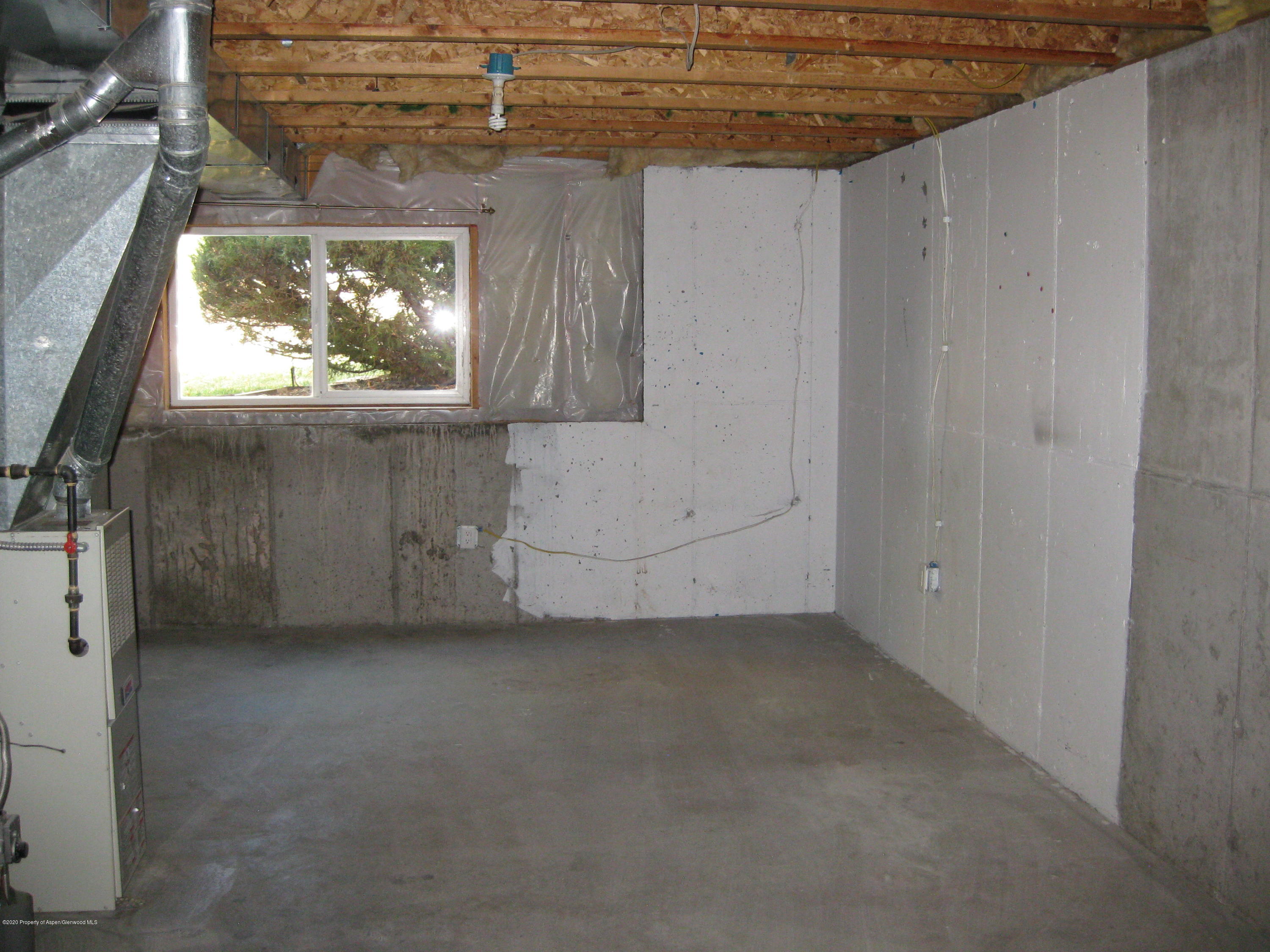 1588 Anvil View Avenue Rifle, CO 81650 - Photo 12 of 15 a view of a livingroom with an empty space and a window