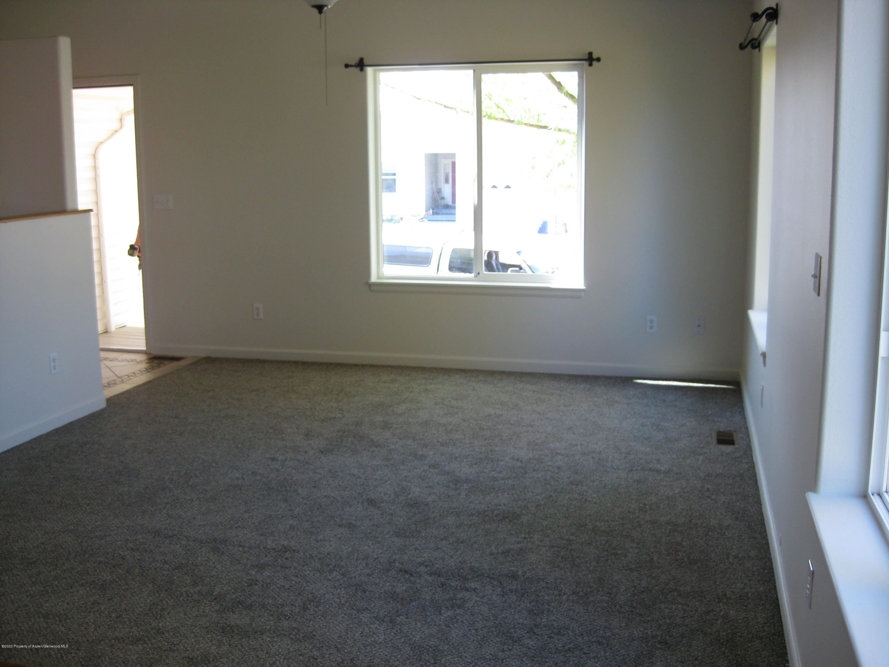 1588 Anvil View Avenue Rifle, CO 81650 - Photo 4 of 15 an empty room with a window