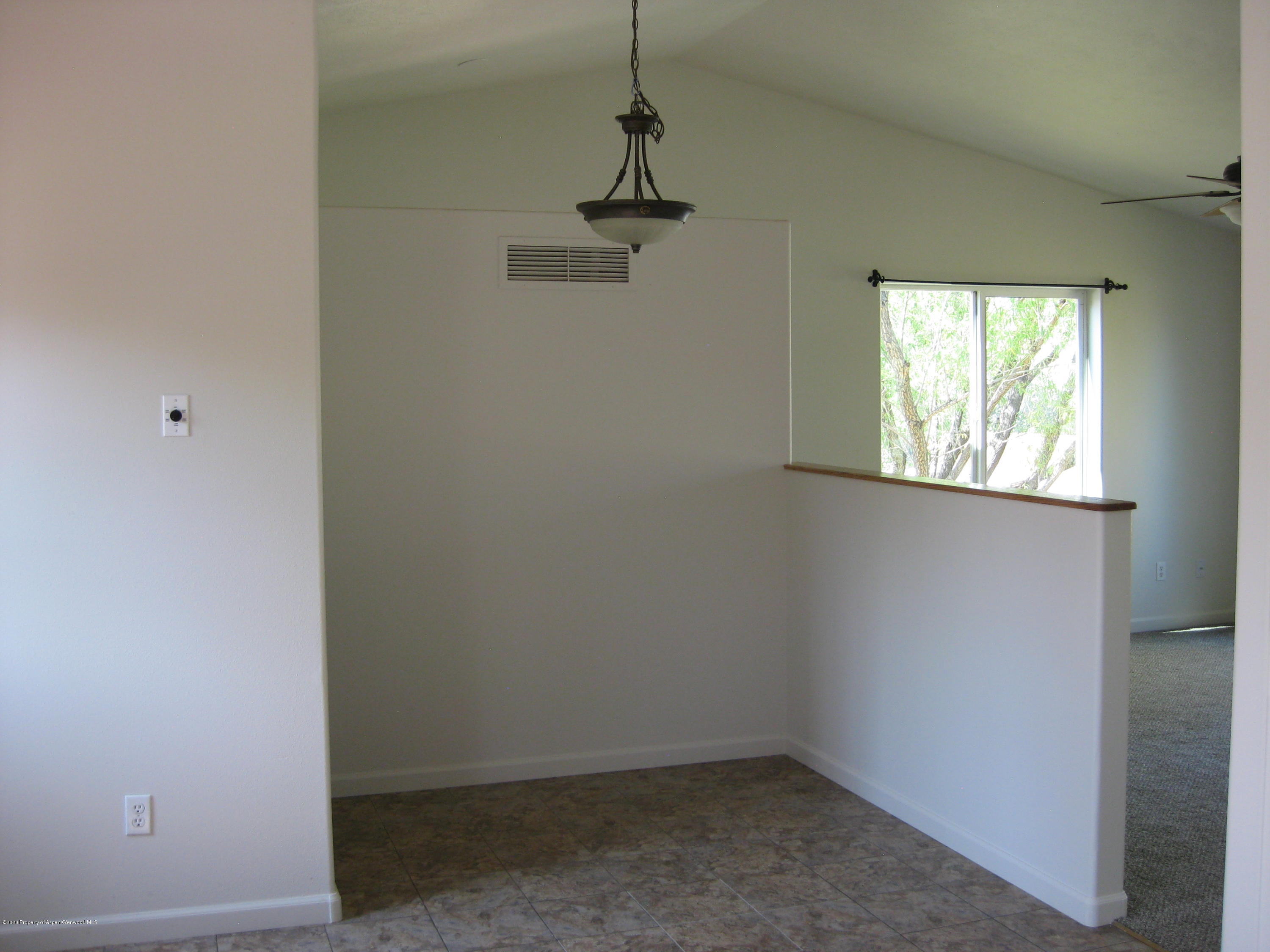 1588 Anvil View Avenue Rifle, CO 81650 - Photo 7 of 15 an empty room with windows