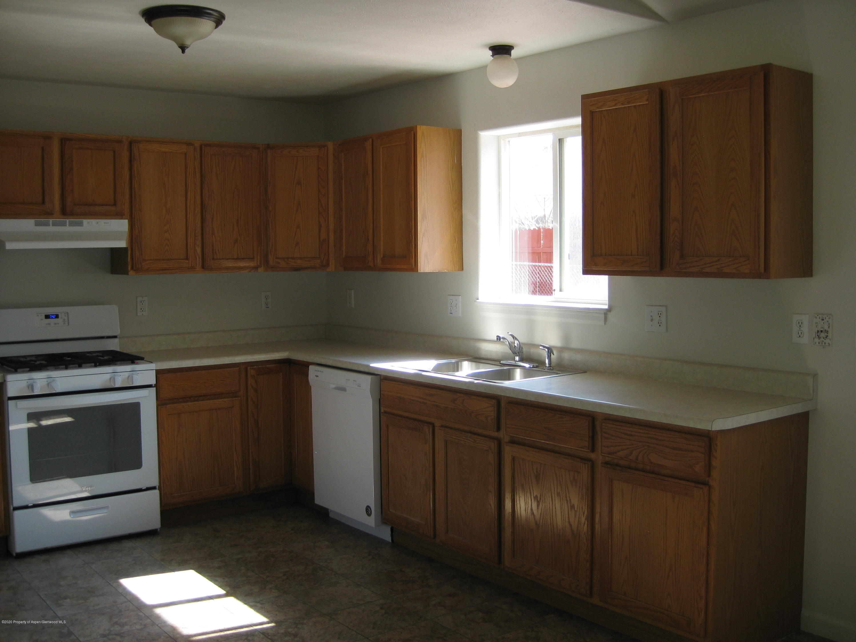 1588 Anvil View Avenue Rifle, CO 81650 - Photo 9 of 15 a kitchen with a sink cabinets and window