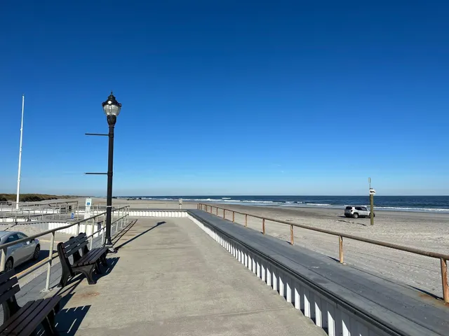 a bedroom with two beds and a window
