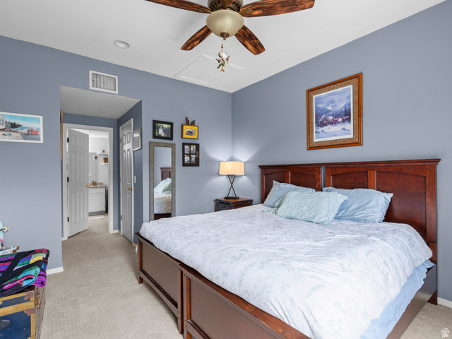 900 Bitner Road, Unit D 34 Park City, UT 84098 - Photo 12 of 25 Bedroom with light colored carpet, ensuite bath, and a ceiling fan