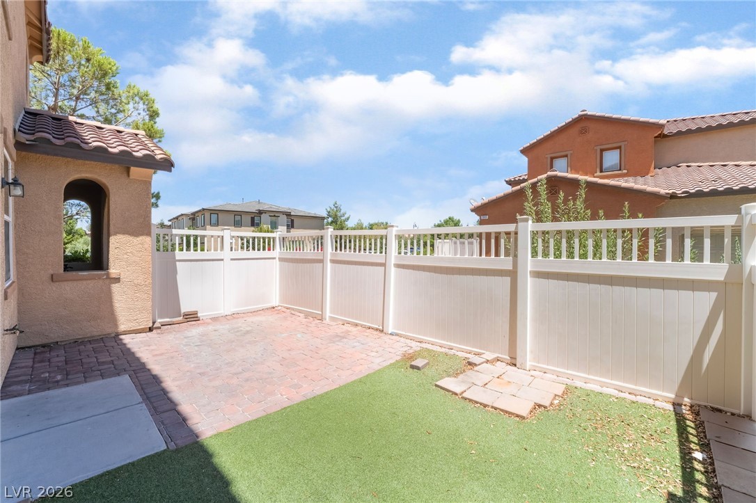 3175 Via Seranova Henderson, NV 89044 - Photo 37 of 45 This private outdoor space offers both paved and artificial turf areas, perfect for relaxation.