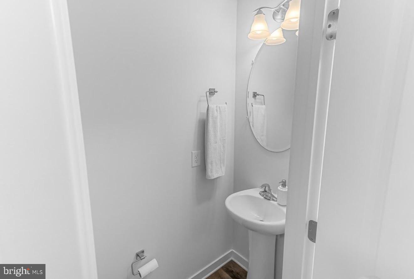 123 Hank Aaron Road Berkeley Springs, WV 25411 - Photo 16 of 32 Sleek and modern half-bath retreat.