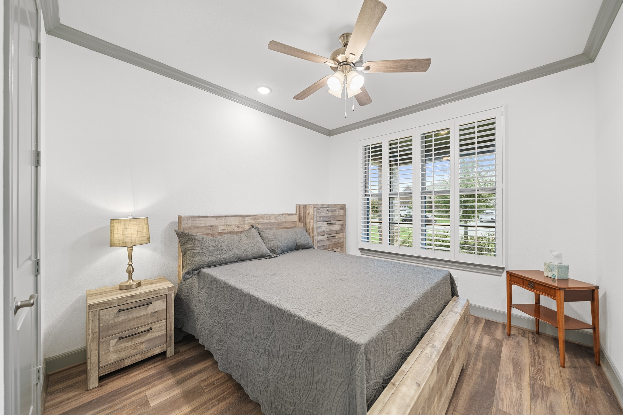 5739 Bobwhite Trail Manvel, TX 77578 - Photo 20 of 29 Comfortable and inviting, this secondary bedroom features plantation shutters that add charm while providing privacy and natural light control. It's an ideal space for family or overnight guests.