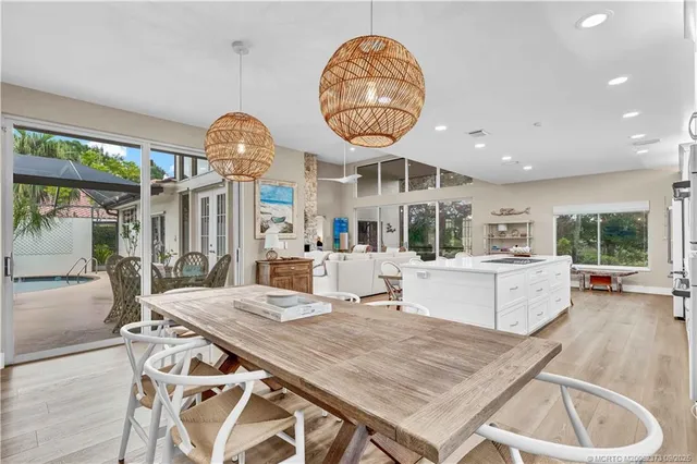 a view of kitchen with furniture and a large window