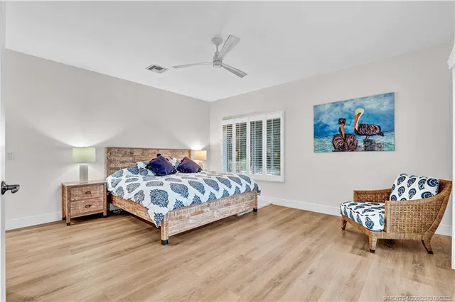 a spacious bedroom with a bed and a couch