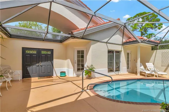 a bedroom with two beds and a dresser