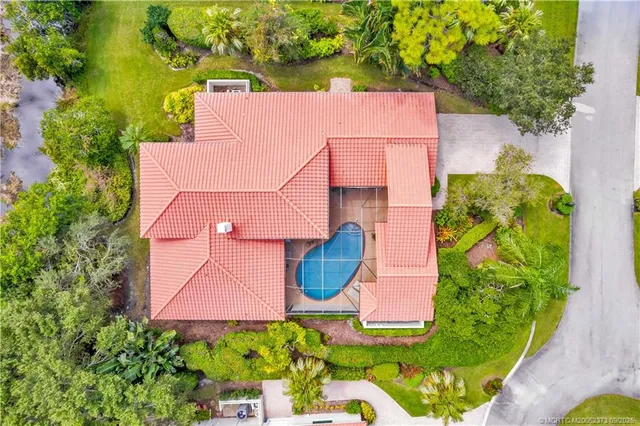 an aerial view of a house with a garden
