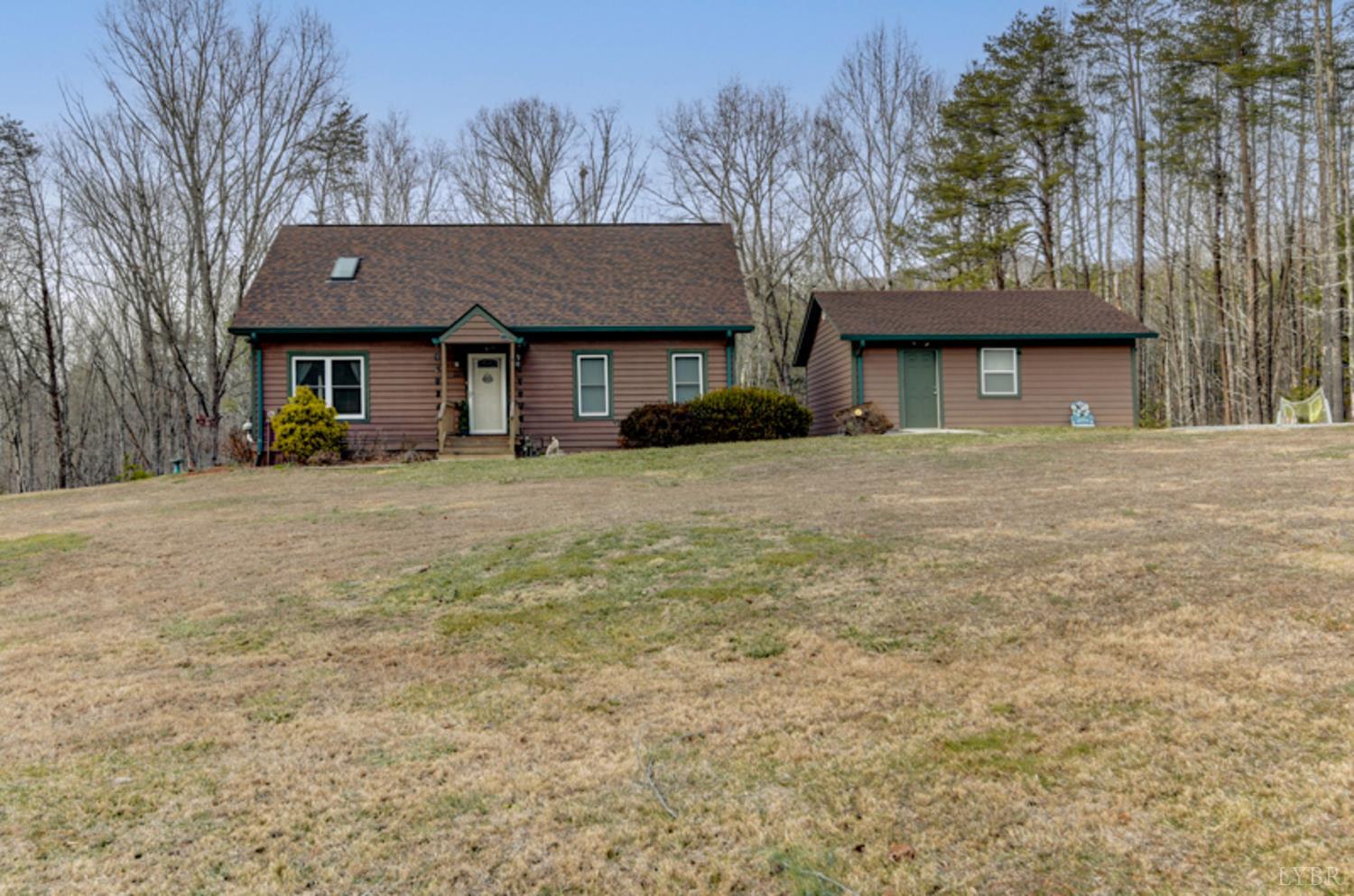 223 Cahas Mountain Road Boones Mill, VA 24065 - Photo 1 of 50 a front view of a house with a yard