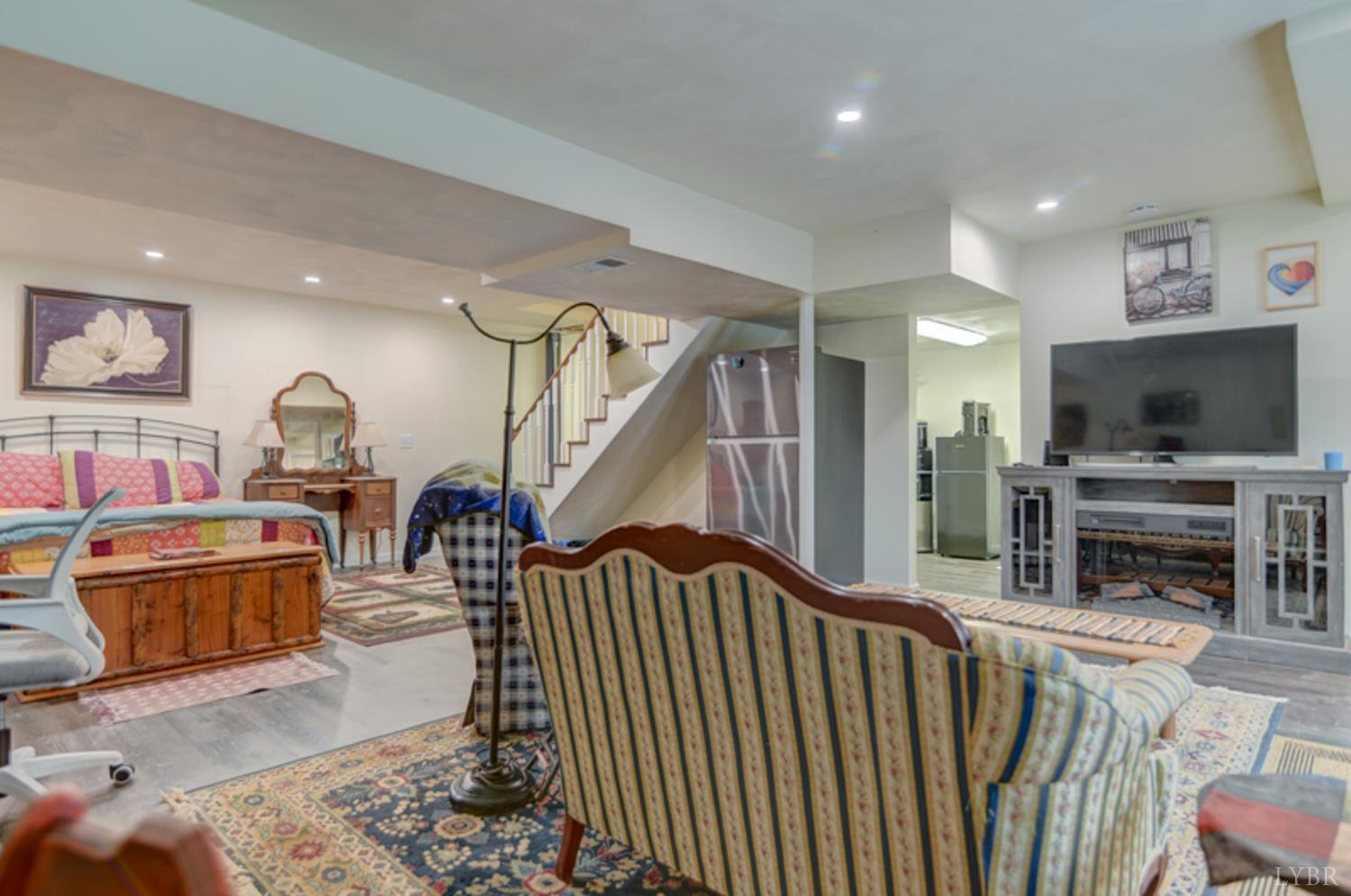 223 Cahas Mountain Road Boones Mill, VA 24065 - Photo 25 of 50 a living room with furniture and a flat screen tv