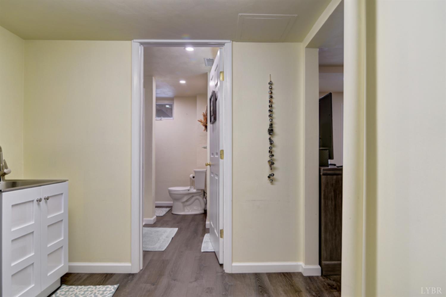 223 Cahas Mountain Road Boones Mill, VA 24065 - Photo 27 of 50 a bathroom with a granite countertop toilet