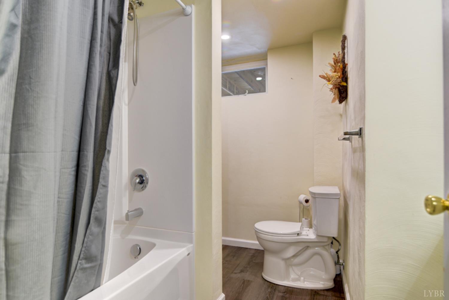 223 Cahas Mountain Road Boones Mill, VA 24065 - Photo 28 of 50 a bathroom with a toilet and a bathtub