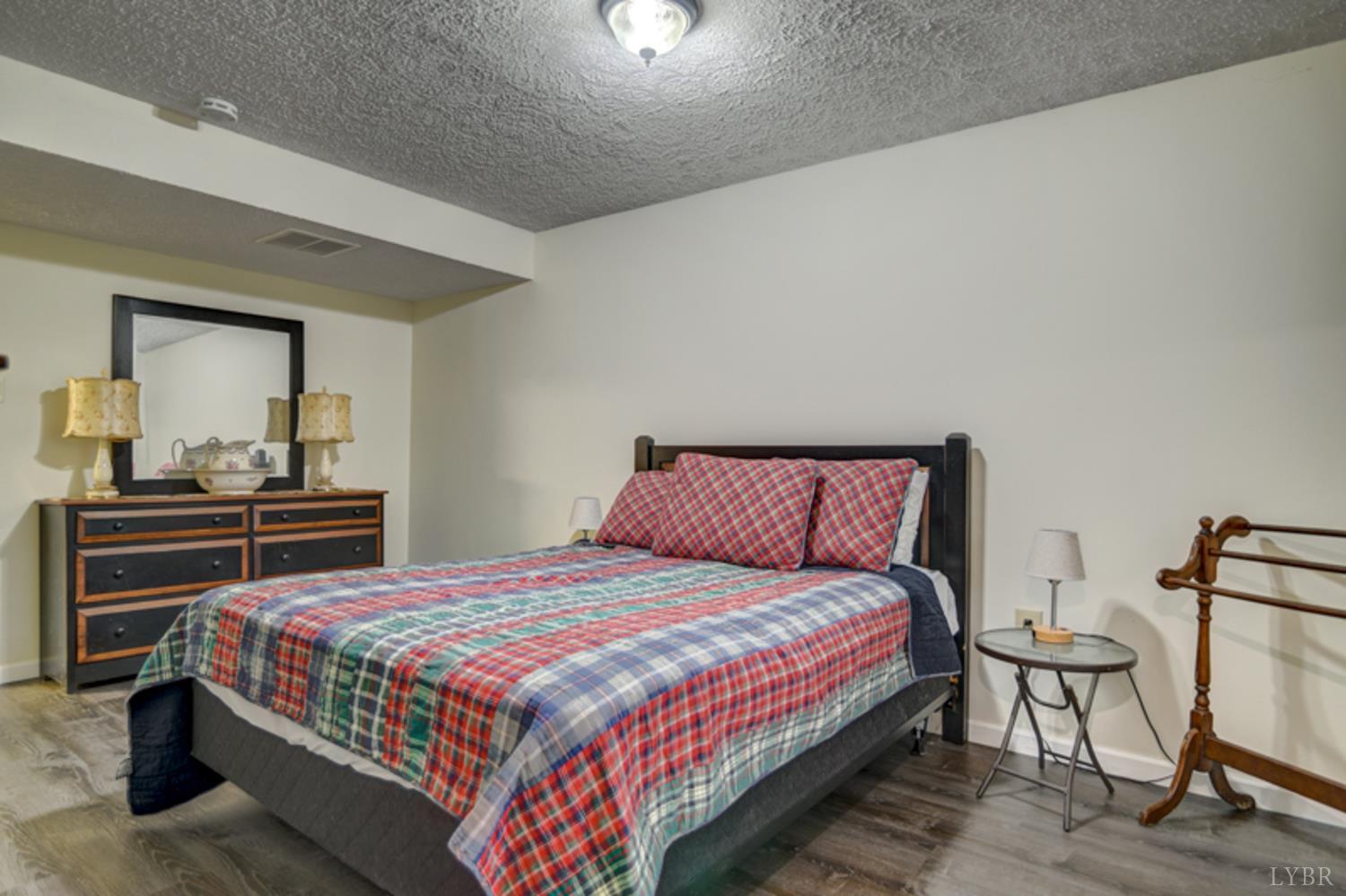 223 Cahas Mountain Road Boones Mill, VA 24065 - Photo 30 of 50 a bedroom with a bed and dresser