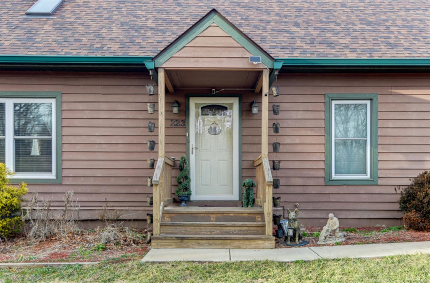 223 Cahas Mountain Road Boones Mill, VA 24065 - Photo 3 of 50 a front view of a house with garden