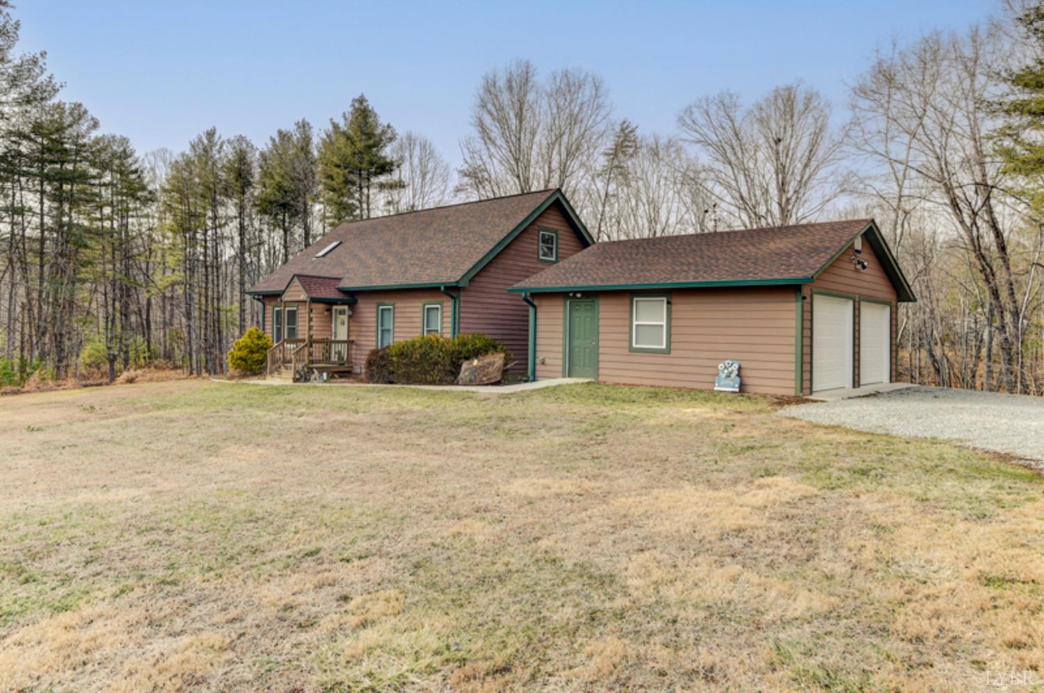 223 Cahas Mountain Road Boones Mill, VA 24065 - Photo 34 of 50 a front view of a house with a yard covered with snow