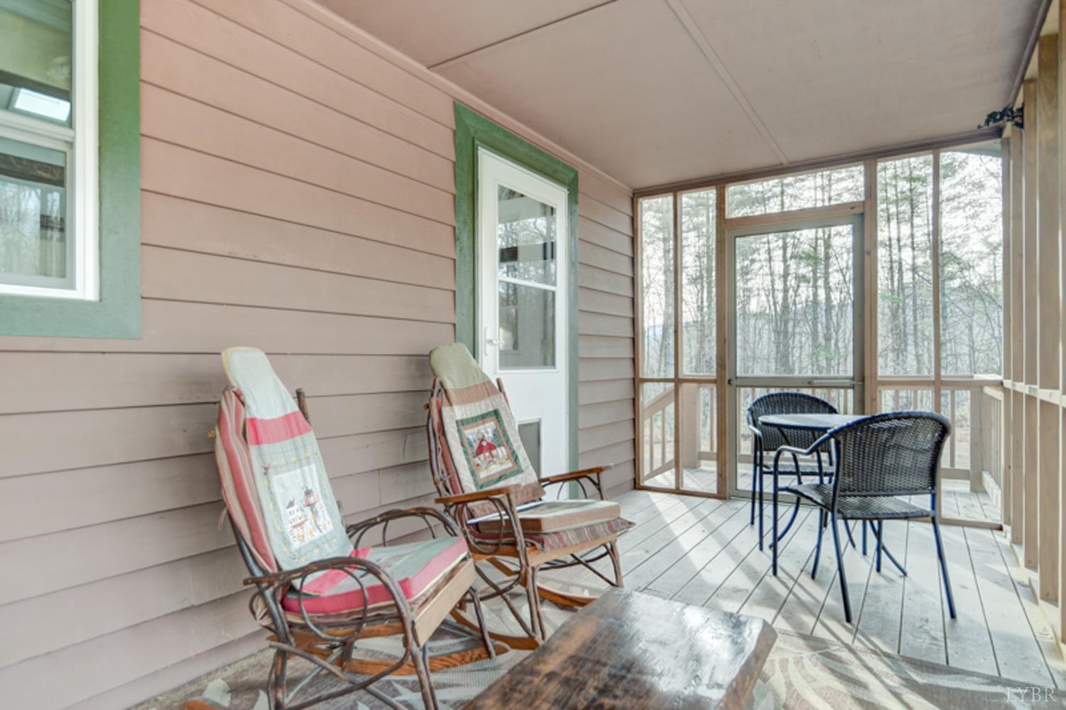 223 Cahas Mountain Road Boones Mill, VA 24065 - Photo 43 of 50 a view of a tables and chairs in balcony