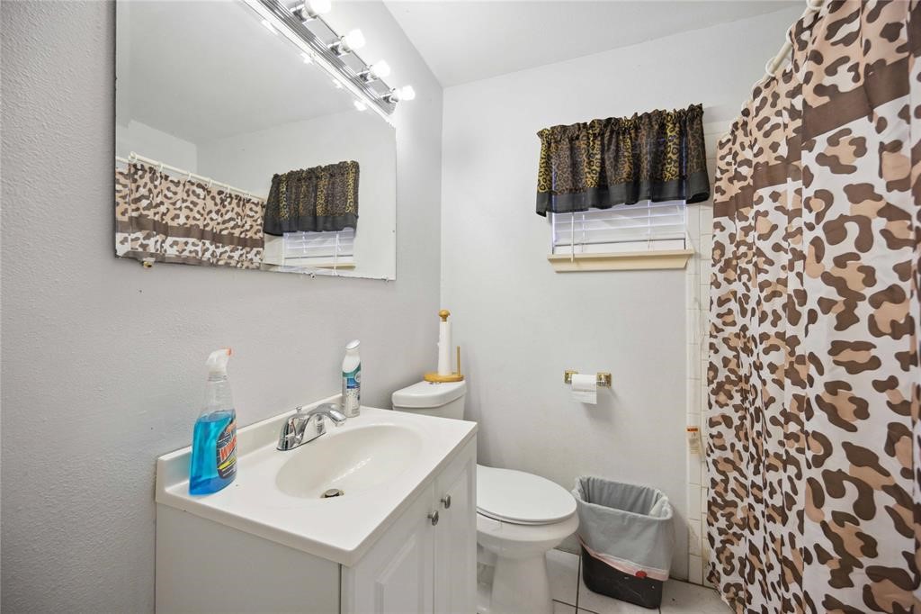 609 West Parker Road Houston, TX 77091 - Photo 5 of 7 a bathroom with a sink toilet and shower