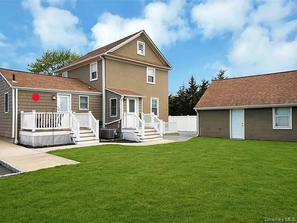 462 Moriches Road St. James, NY 11780 - Photo 15 of 17 Back of house featuring a yard and TREX DECK