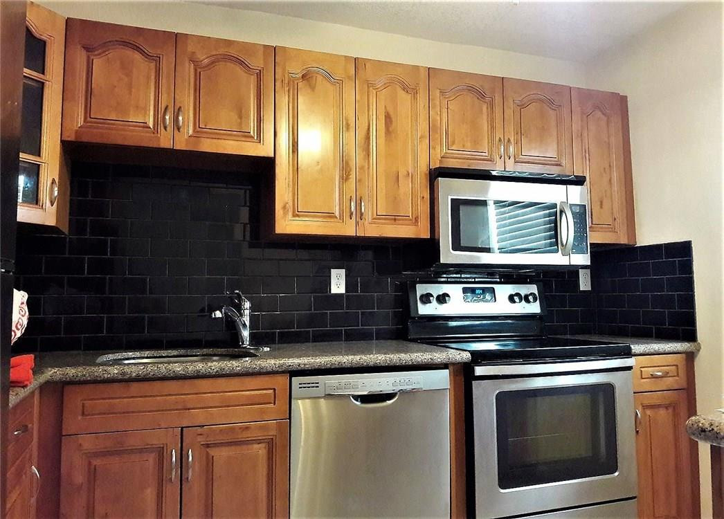 8605 West Sample Road, Unit 211 Coral Springs, FL 33065 - Photo 1 of 31 Kitchen