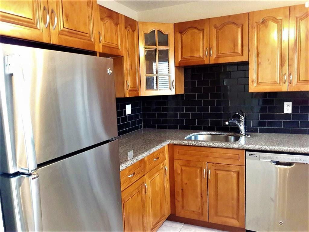 8605 West Sample Road, Unit 211 Coral Springs, FL 33065 - Photo 2 of 31 Kitchen
