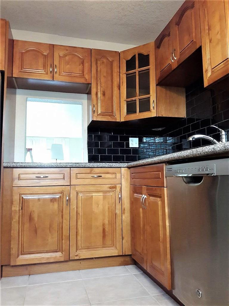 8605 West Sample Road, Unit 211 Coral Springs, FL 33065 - Photo 4 of 31 Kitchen