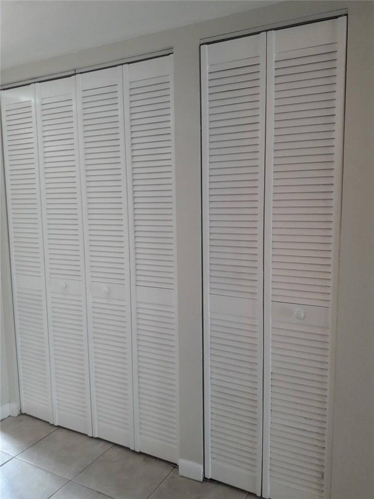 8605 West Sample Road, Unit 211 Coral Springs, FL 33065 - Photo 5 of 31 Entry Closet/ Closet to AC