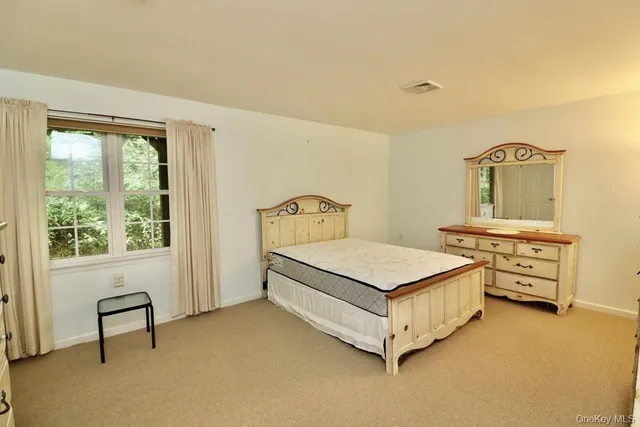 a bedroom with a bed and a table in it