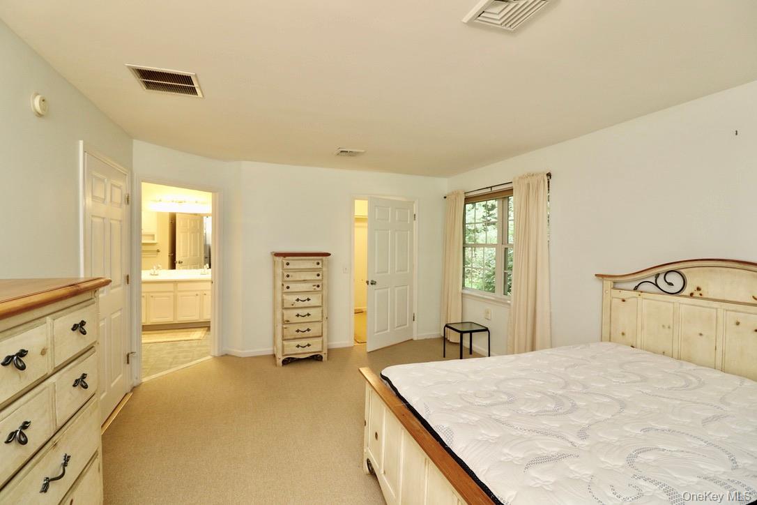 29 Lamplight Street Beacon, NY 12508 - Photo 16 of 22 a bedroom with a bed and a dresser