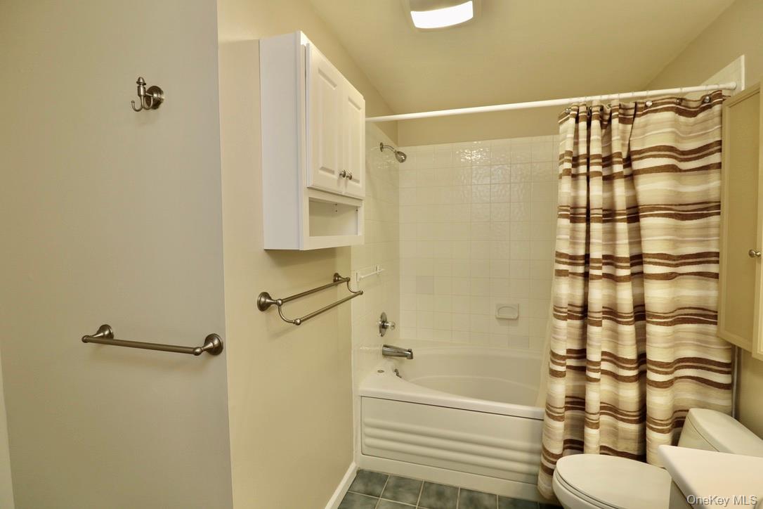 29 Lamplight Street Beacon, NY 12508 - Photo 18 of 22 a bathroom with a shower and a toilet