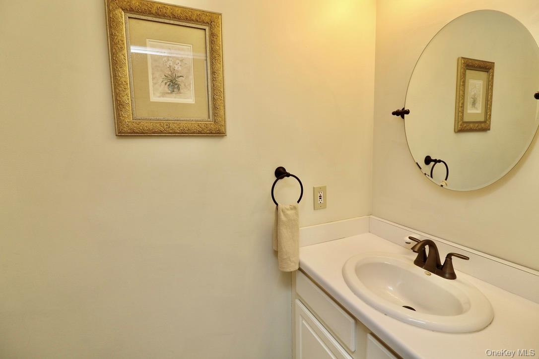 29 Lamplight Street Beacon, NY 12508 - Photo 22 of 22 a bathroom with a sink and a mirror