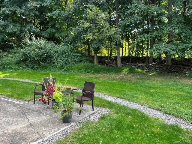 a garden with trees and flowers