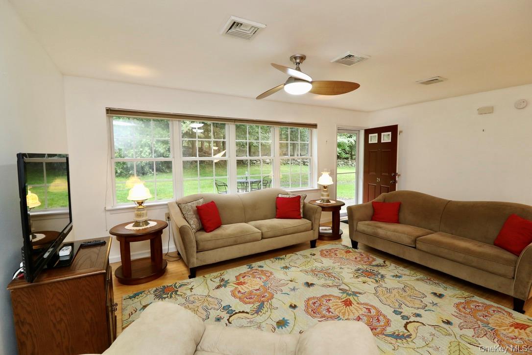 29 Lamplight Street Beacon, NY 12508 - Photo 7 of 22 a living room with furniture and a large window