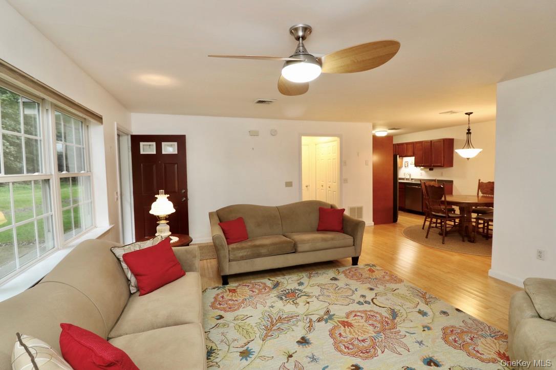 29 Lamplight Street Beacon, NY 12508 - Photo 9 of 22 a living room with furniture and a large window