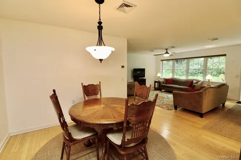 a view of a dining room with furniture window and outside view