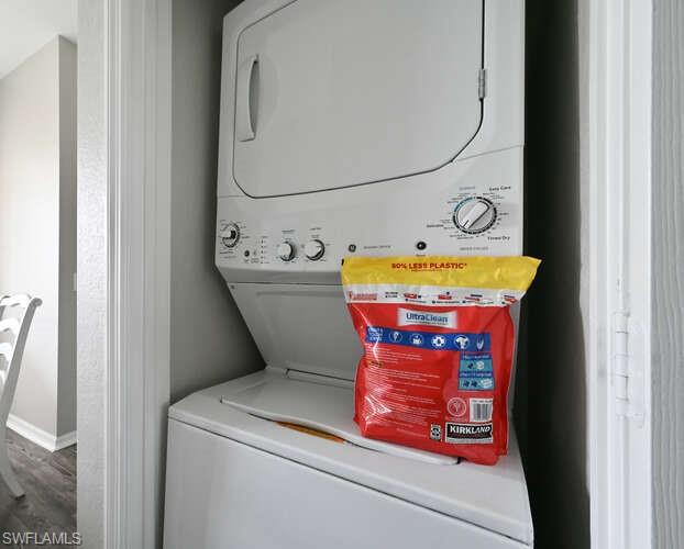 7935 Mahogany Run Lane, Unit 725 Naples, FL 34113 - Photo 10 of 27 a utility room with dryer and washer