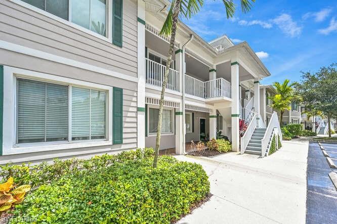 7935 Mahogany Run Lane, Unit 725 Naples, FL 34113 - Photo 11 of 27 a view of a building with a street