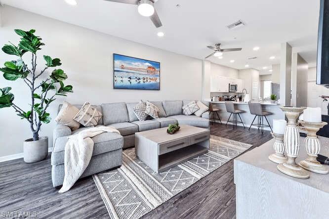 7935 Mahogany Run Lane, Unit 725 Naples, FL 34113 - Photo 12 of 27 a living room with furniture or couch and a potted plant