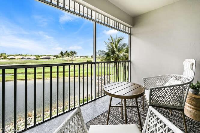 7935 Mahogany Run Lane, Unit 725 Naples, FL 34113 - Photo 14 of 27 a view of a balcony with chair