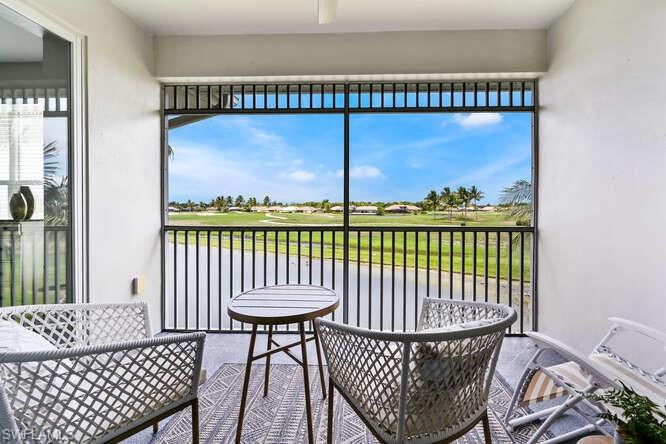 7935 Mahogany Run Lane, Unit 725 Naples, FL 34113 - Photo 17 of 27 a view of a balcony with furniture