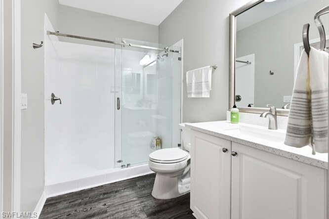 7935 Mahogany Run Lane, Unit 725 Naples, FL 34113 - Photo 18 of 27 a bathroom with a sink toilet and shower