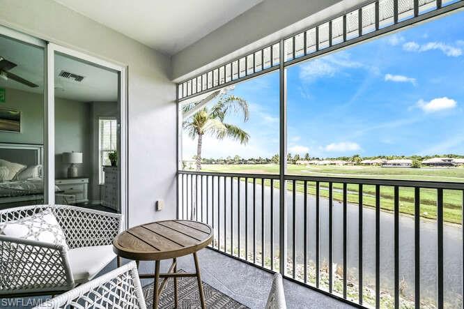 7935 Mahogany Run Lane, Unit 725 Naples, FL 34113 - Photo 19 of 27 a view of a balcony with furniture